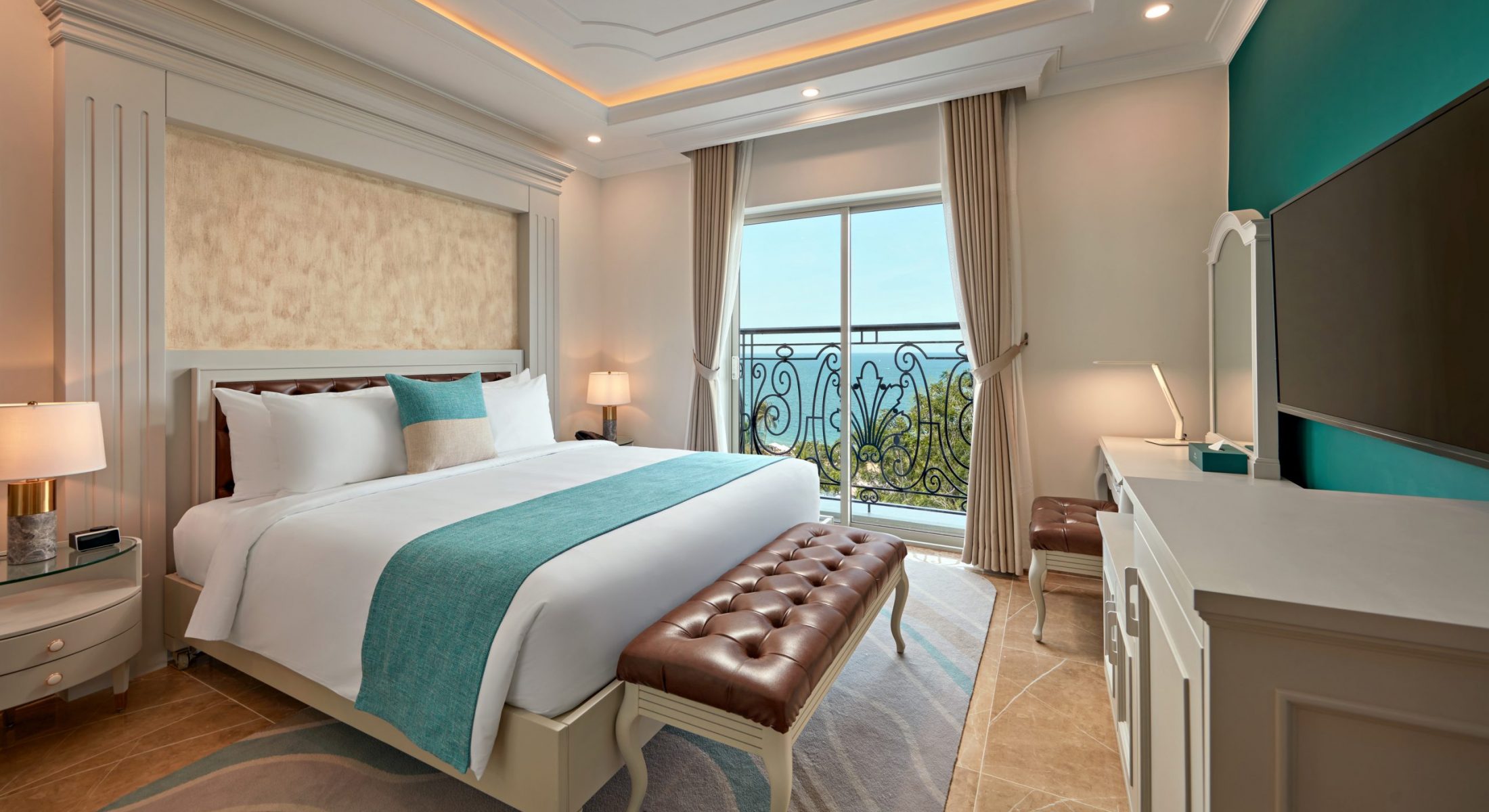 Comfortable hotel bedroom with ocean views in privilege luxe room